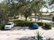 View of the community parking lot with several cars at 4450 47Th W Ave # 202, Bradenton, FL 34210