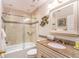 Bathroom with tub, shower, and granite vanity at 4450 47Th W Ave # 202, Bradenton, FL 34210