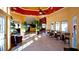 Spacious lobby area with tiled floors, reception area, holiday decor, and multiple seating options at 4450 47Th W Ave # 202, Bradenton, FL 34210