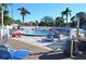 Community pool featuring plentiful lounge seating on a well-maintained deck, perfect for relaxing outdoors at 4450 47Th W Ave # 202, Bradenton, FL 34210