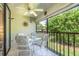 Screened lanai with patio furniture and lush greenery view at 4450 47Th W Ave # 202, Bradenton, FL 34210
