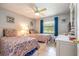 Guest bedroom with twin beds and a ceiling fan at 4450 47Th W Ave # 202, Bradenton, FL 34210