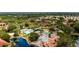 Aerial view of community pool, tennis courts, and home location at 4450 47Th W Ave # 202, Bradenton, FL 34210