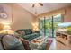 Living room with leather couches and access to balcony at 4450 47Th W Ave # 202, Bradenton, FL 34210