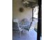 Screened balcony with patio furniture and ceiling fan at 4450 47Th W Ave # 202, Bradenton, FL 34210