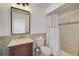 Bathroom featuring a vanity, toilet, and a shower-tub combination with decorative tile at 4989 Clubview E Ct, Bradenton, FL 34203