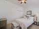 Bright bedroom with clean white walls, ceiling fan, and ample closet space at 4989 Clubview E Ct, Bradenton, FL 34203