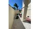 Side courtyard with chairs and rock gardens leading to a charming outdoor seating space at 4989 Clubview E Ct, Bradenton, FL 34203