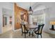 Stylish dining room featuring a contemporary light fixture and an accent wall at 4989 Clubview E Ct, Bradenton, FL 34203