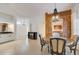 Open-concept dining area with decorative light fixture and a view into the open-concept kitchen at 4989 Clubview E Ct, Bradenton, FL 34203