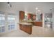Bright kitchen with stainless steel appliances, granite countertops and access to outdoor space at 4989 Clubview E Ct, Bradenton, FL 34203