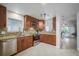 Well-appointed kitchen with stainless steel appliances, granite countertops and tile backsplash at 4989 Clubview E Ct, Bradenton, FL 34203