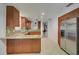 Bright kitchen with stainless steel appliances, wood cabinets and granite countertops at 4989 Clubview E Ct, Bradenton, FL 34203
