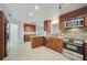Open concept kitchen with stainless steel appliances, granite countertops and tile backsplash at 4989 Clubview E Ct, Bradenton, FL 34203