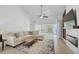 The living room has a fireplace, flatscreen television and sliding glass doors to the exterior at 4989 Clubview E Ct, Bradenton, FL 34203