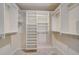 Well-organized walk-in closet featuring built-in shelving and ample storage space at 4989 Clubview E Ct, Bradenton, FL 34203