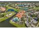 Community clubhouse with pool, tennis courts, and parking area at 4989 Clubview E Ct, Bradenton, FL 34203
