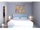 Bright bedroom with light blue headboard and wood floors at 2170 Robinhood Street # A1-405, Sarasota, FL 34231