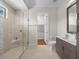 Spa-like bathroom with glass shower, built-in bench, and modern vanity at 11826 River Shores Trl, Parrish, FL 34219