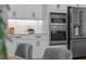 Sleek kitchen with stainless steel appliances and white cabinets at 11826 River Shores Trl, Parrish, FL 34219