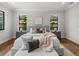 Main bedroom with hardwood floors and a cozy atmosphere at 11826 River Shores Trl, Parrish, FL 34219
