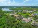 Luxury property with pool and lush surroundings, overlooking a waterway at 11826 River Shores Trl, Parrish, FL 34219