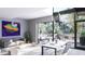 Living room with patio access and modern furniture at 2170 Robinhood Street # A3-219, Sarasota, FL 34231