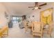 Living room with water views and dining area at 9011 Midnight Pass Rd # 228, Sarasota, FL 34242