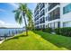 Waterfront building exterior showcasing a condo with balcony at 9011 Midnight Pass Rd # 228, Sarasota, FL 34242