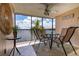 Relaxing screened-in balcony overlooking the water with outdoor seating at 9011 Midnight Pass Rd # 228, Sarasota, FL 34242