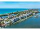 Aerial view of waterfront condo building at 9011 Midnight Pass Rd # 228, Sarasota, FL 34242