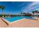 Inviting community swimming pool with brick deck and ample lounge space at 9011 Midnight Pass Rd # 228, Sarasota, FL 34242