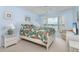 Bedroom with waterfront views, a comfortable bed, and built-in TV at 9011 Midnight Pass Rd # 228, Sarasota, FL 34242