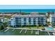Aerial view of waterfront community with pool and boat slips at 9011 Midnight Pass Rd # 228, Sarasota, FL 34242