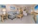 Living room features a sofa, coffee table, and neutral color scheme at 9011 Midnight Pass Rd # 228, Sarasota, FL 34242