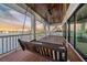 Relaxing balcony with water views and a porch swing at 535 70Th St, Holmes Beach, FL 34217