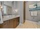 Modern bathroom with wood vanity and marble shower at 535 70Th St, Holmes Beach, FL 34217