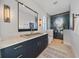 Modern bathroom with a concrete sink, a large mirror, and a glass shower at 535 70Th St, Holmes Beach, FL 34217