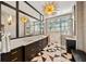 Elegant bathroom with double vanity and marble floors at 535 70Th St, Holmes Beach, FL 34217