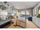 Spacious bedroom with a canopy bed, water views, and ample natural light at 535 70Th St, Holmes Beach, FL 34217