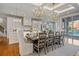 Open concept dining area features a large table and stunning water views at 535 70Th St, Holmes Beach, FL 34217