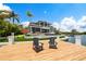 Relaxing dock with waterfront views and two Adirondack chairs at 535 70Th St, Holmes Beach, FL 34217