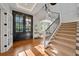 Bright entryway with hardwood floors and elegant staircase at 535 70Th St, Holmes Beach, FL 34217