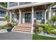 Elegant front entrance with double doors and landscaped walkway at 535 70Th St, Holmes Beach, FL 34217