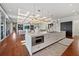 Modern kitchen with island, stainless steel appliances and hardwood floors at 535 70Th St, Holmes Beach, FL 34217