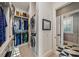 Convenient laundry room with washer, dryer, and shelving at 535 70Th St, Holmes Beach, FL 34217