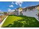 Expansive green lawn with waterfront views and luxurious home at 535 70Th St, Holmes Beach, FL 34217