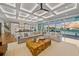 Spacious living room boasts water views, coffered ceiling, and large sectional sofa at 535 70Th St, Holmes Beach, FL 34217