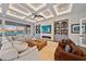 Bright living room with fireplace, built-in shelving, and comfortable seating at 535 70Th St, Holmes Beach, FL 34217