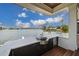 Modern outdoor kitchen with water views and stainless steel appliances at 535 70Th St, Holmes Beach, FL 34217